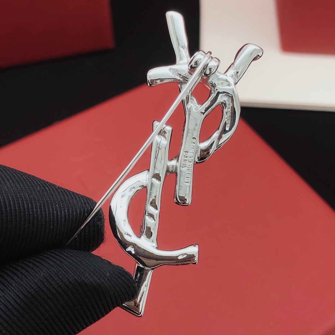 Saint Laurent Cassandre Twisted Monogram Brooch brooch silver-toned metal no accent stones 4 5cm height