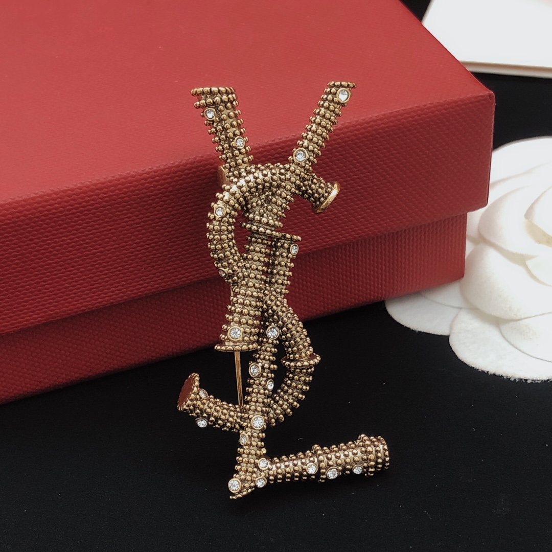 Saint Laurent Cassandre YSL Monogram Beaded Crystal Brooch brooch antique gold tone metal with clear crystal accents 4 5cm length