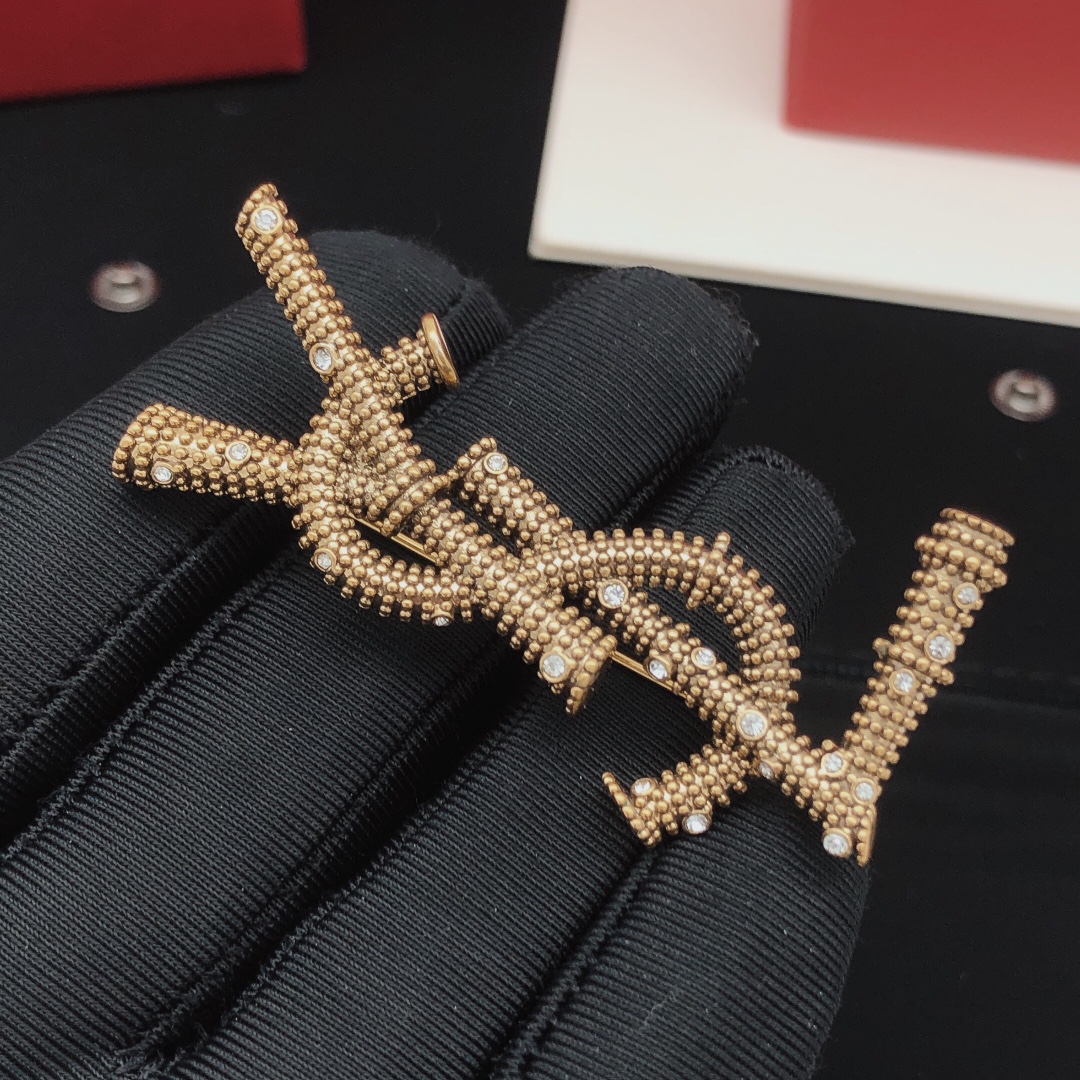 Saint Laurent Cassandre YSL Monogram Beaded Crystal Brooch brooch antique gold tone metal with clear crystal accents 4 5cm length