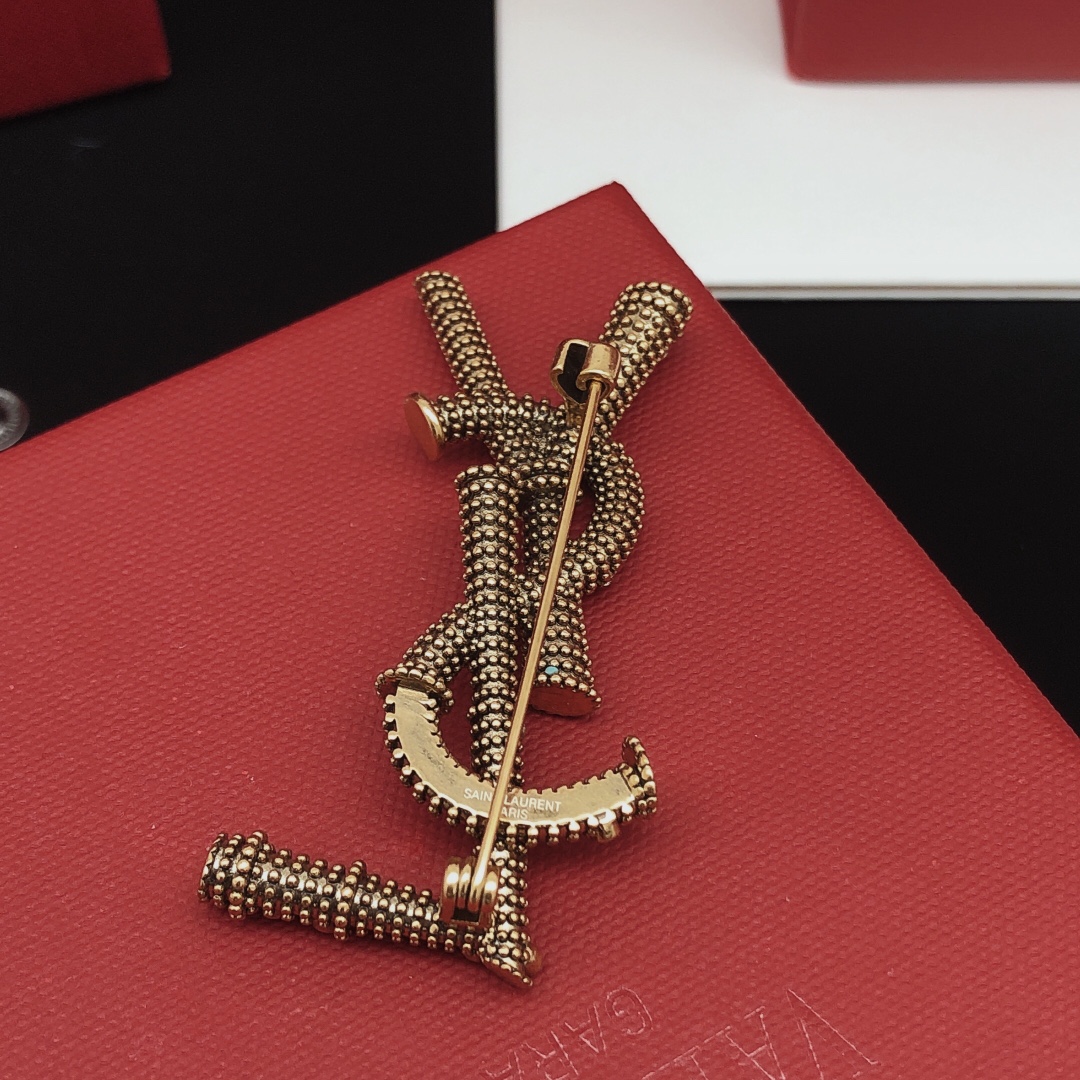 Saint Laurent Cassandre YSL Monogram Beaded Crystal Brooch brooch antique gold tone metal with clear crystal accents 4 5cm length