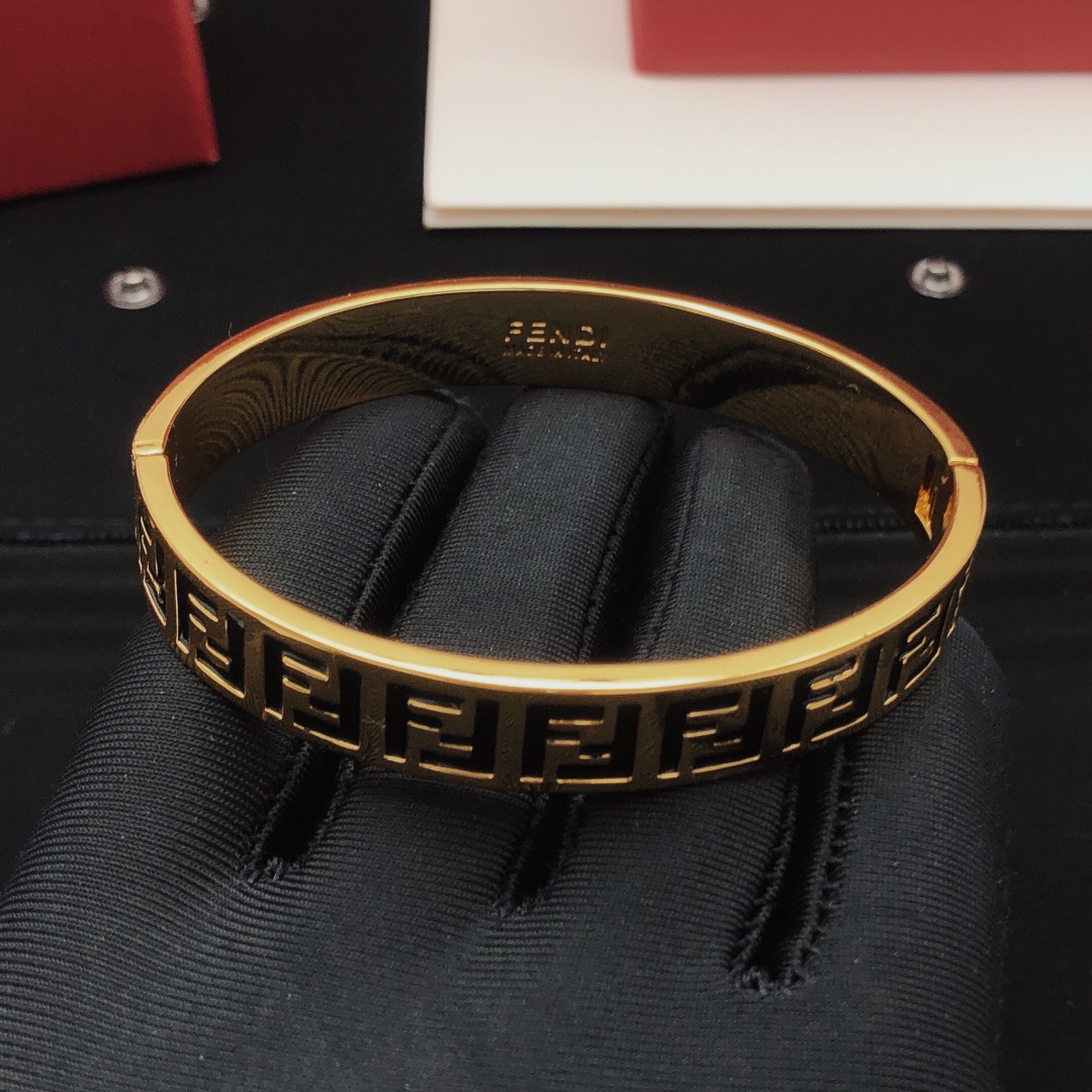 Fendi FF Logo Bangle bracelet gold-tone metal with black enamel FF monogram detailing 17cm inner circumference
