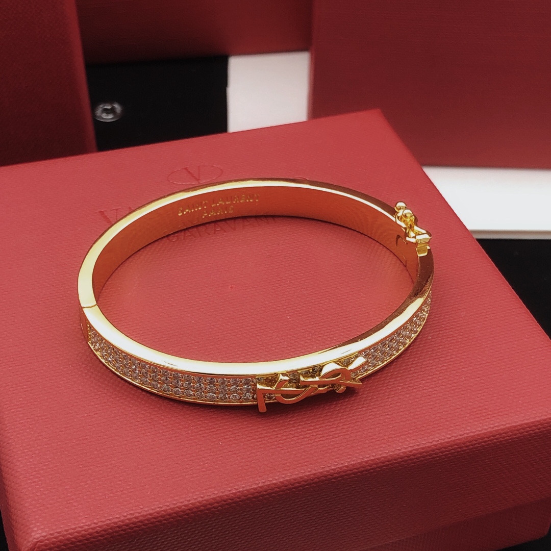 Saint Laurent Cassandre Monogram Pave Bangle bracelet gold-tone metal with clear pave crystals 17cm inner circumference