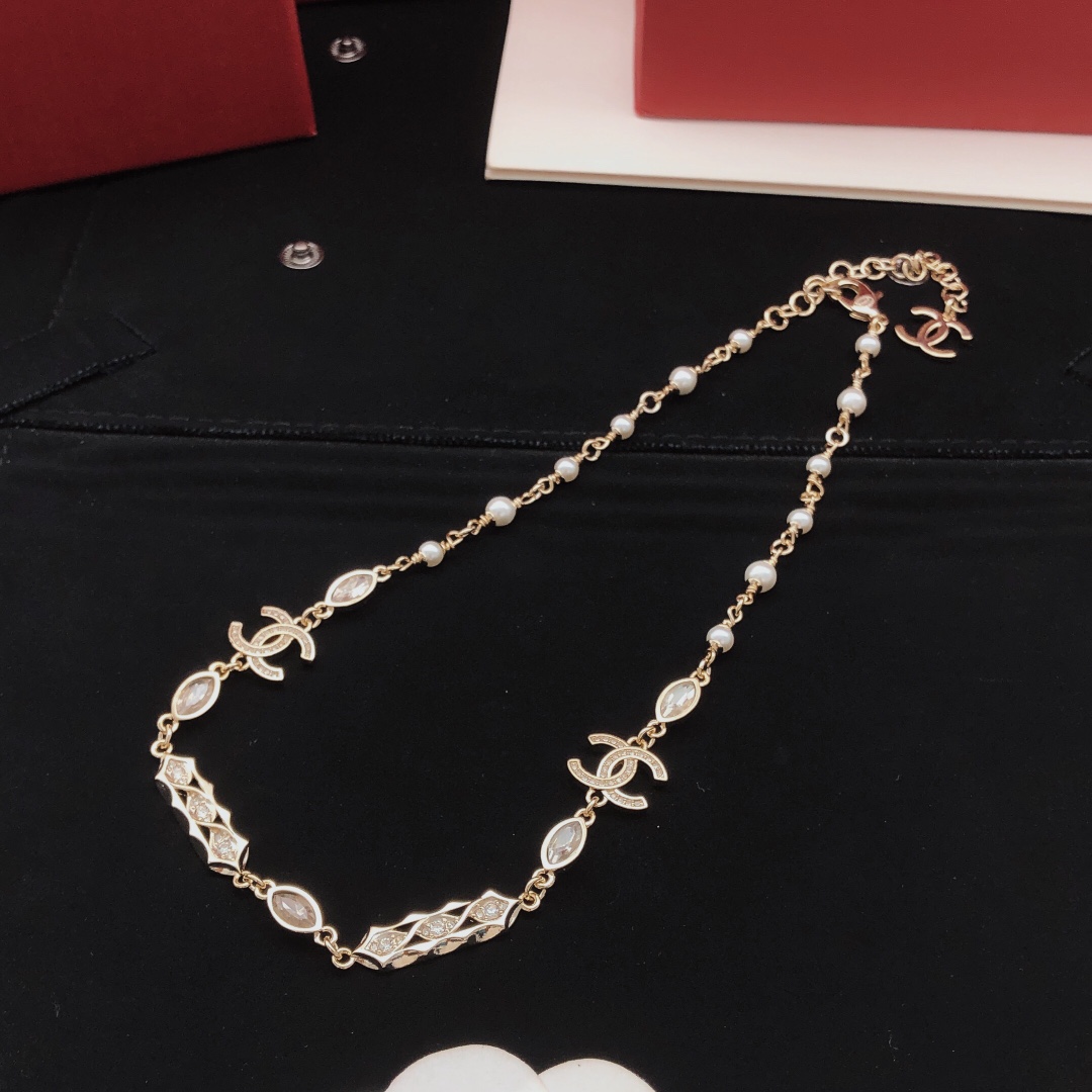Chanel CC Logo Pearl Crystal Choker necklace gold-tone metal white faux pearl clear crystal 40cm with 5cm extender