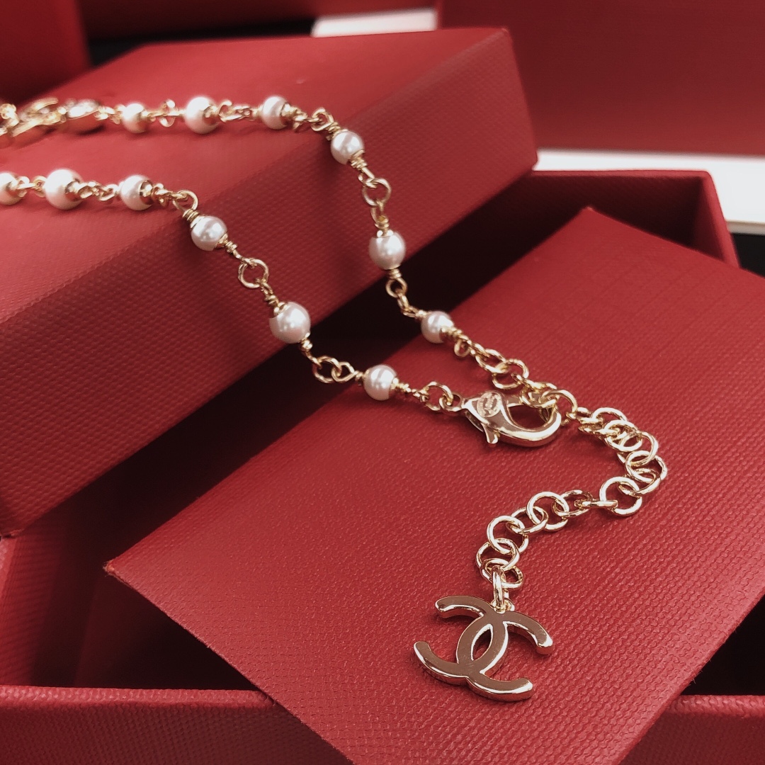 Chanel CC Logo Pearl Crystal Choker necklace gold-tone metal white faux pearl clear crystal 40cm with 5cm extender