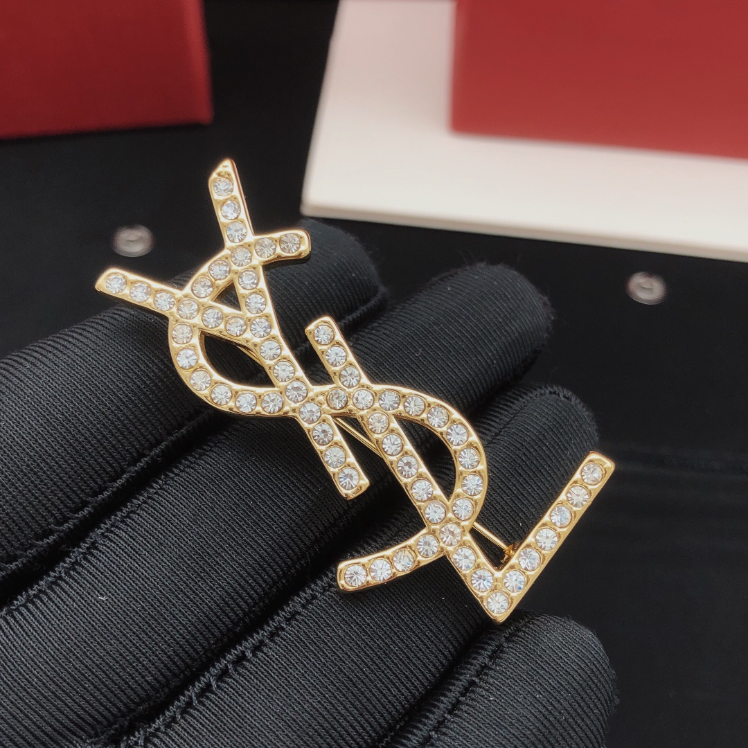 Saint Laurent Cassandre YSL Monogram Brooch brooch gold-tone metal with clear crystal rhinestones 4 5cm length