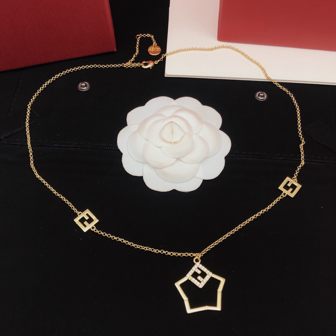 Fendi FF Logo Shield Pendant necklace gold-tone metal with clear crystal accents 45cm with 5cm extender