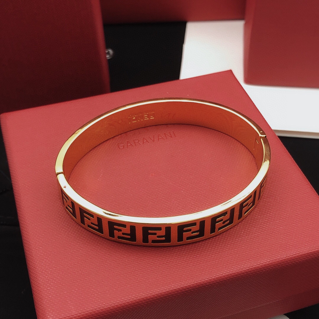Fendi FF Logo Bangle bracelet gold-tone metal with black enamel FF detailing 17cm inner circumference