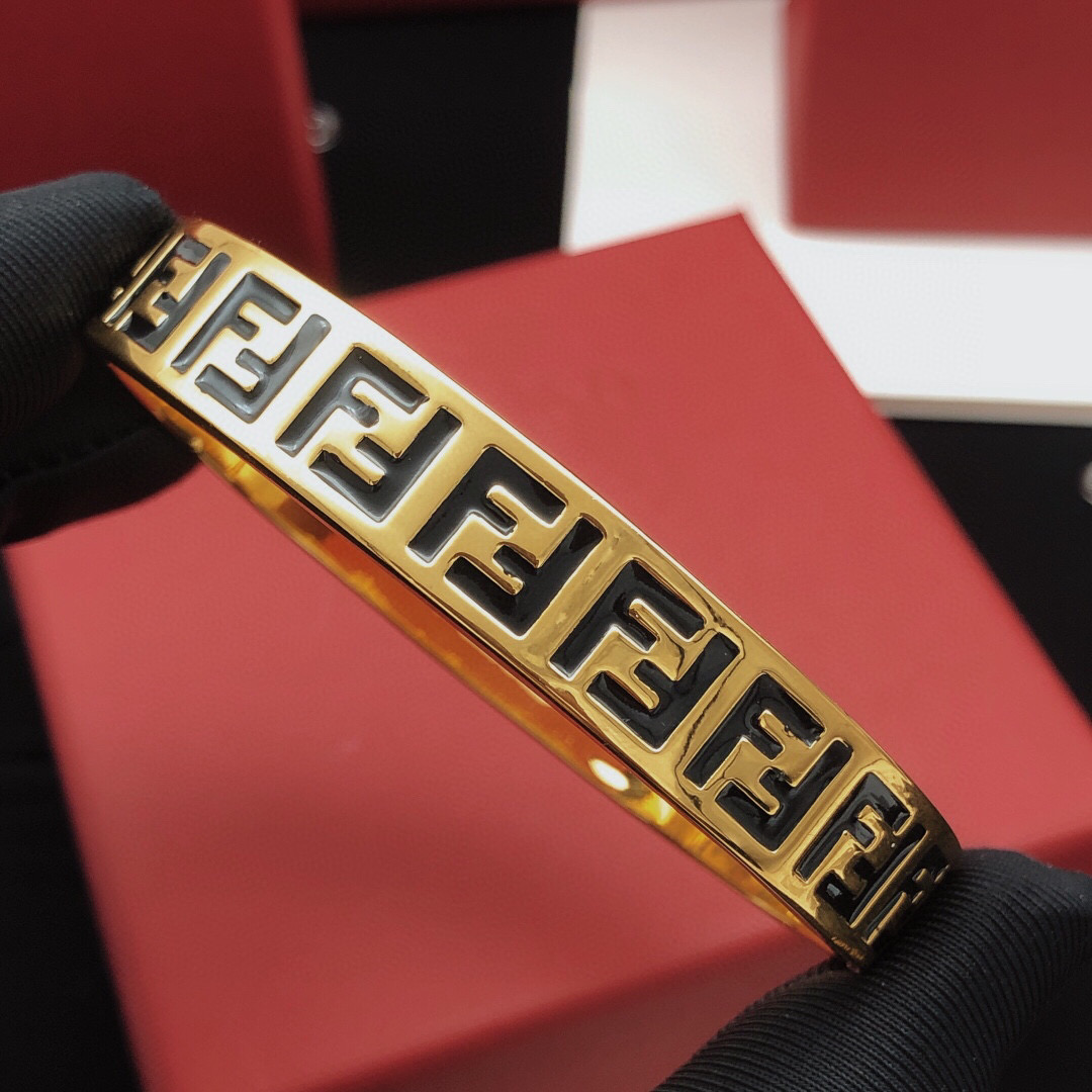 Fendi FF Logo Bangle bracelet gold-tone metal with black enamel FF detailing 17cm inner circumference