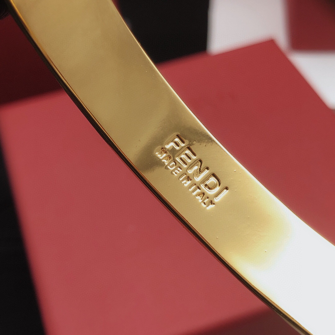 Fendi FF Logo Bangle bracelet gold-tone metal with black enamel FF detailing 17cm inner circumference