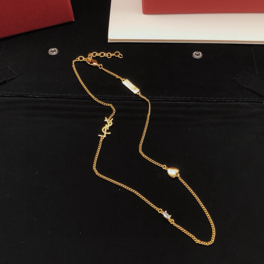 Saint Laurent YSL Monogram Heart Crystal Chain necklace gold-tone metal with clear faceted crystal and polished gold heart charm 42cm with 5cm extender