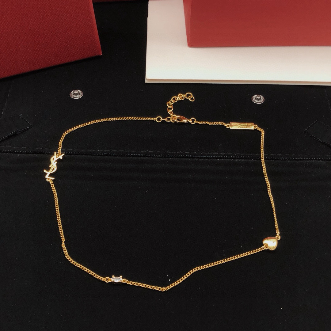 Saint Laurent YSL Monogram Heart Crystal Chain necklace gold-tone metal with clear faceted crystal and polished gold heart charm 42cm with 5cm extender