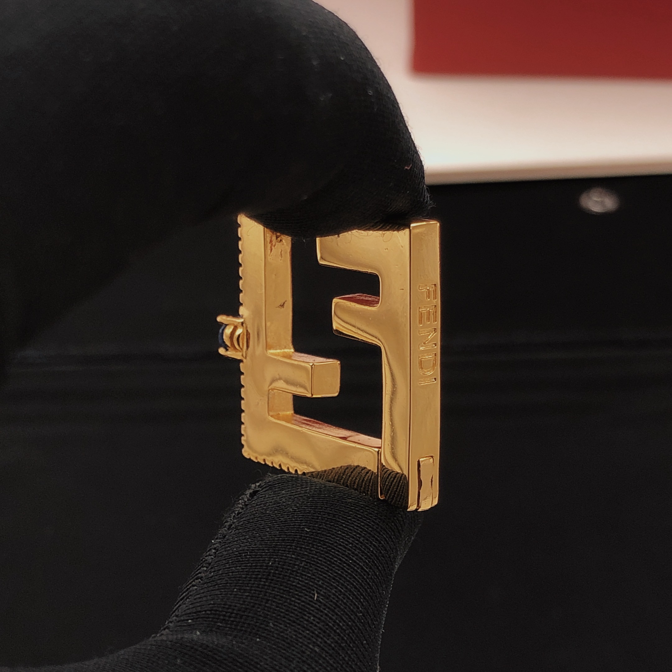 Fendi FF Logo Hoop Earrings earrings gold-tone metal with clear cubic zirconia and dark blue gemstone accents 2 5cm hoop diameter