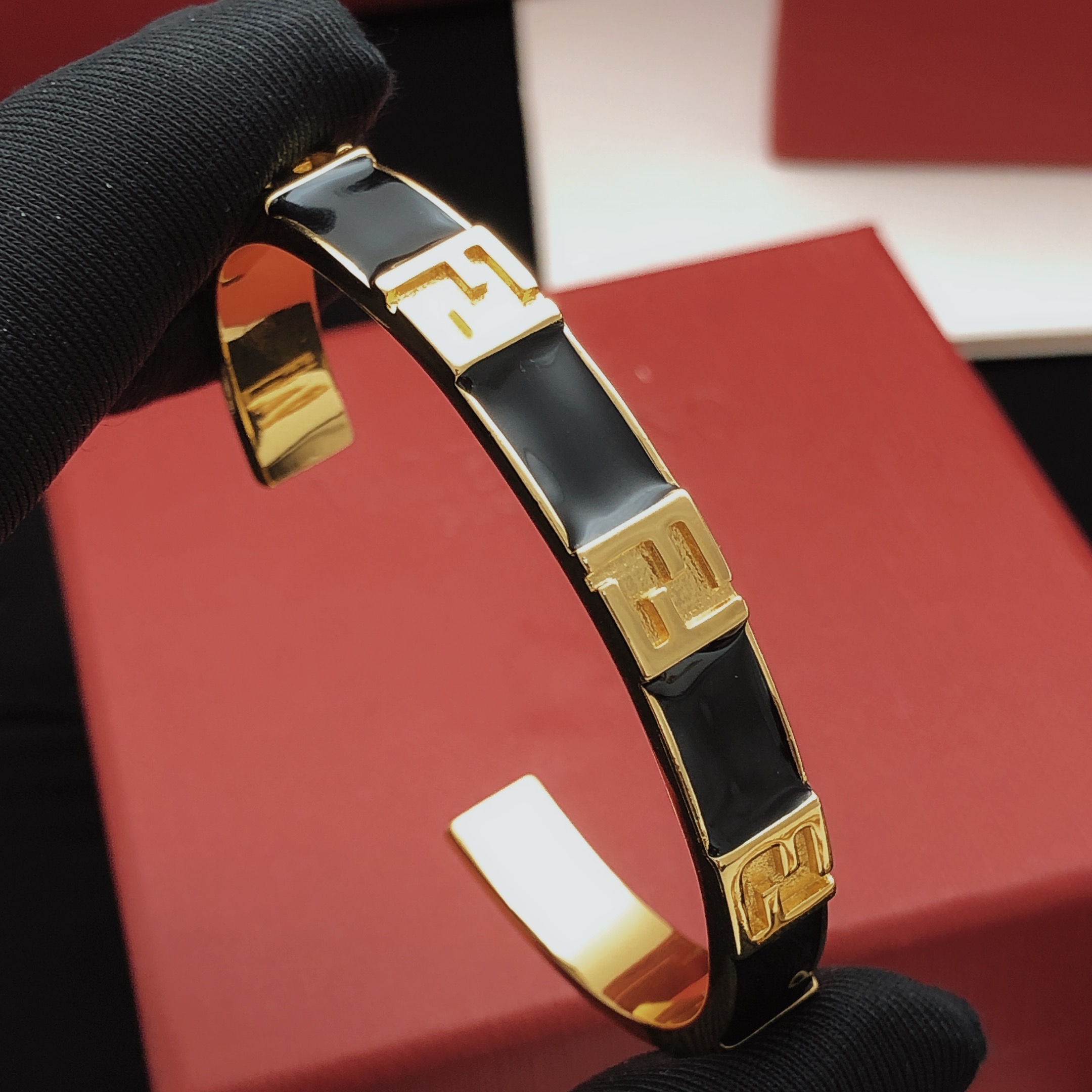 Fendi FF Logo Enamel Cuff bracelet Gold-tone metal with black enamel One Size standard open cuff 6 5cm inner diameter