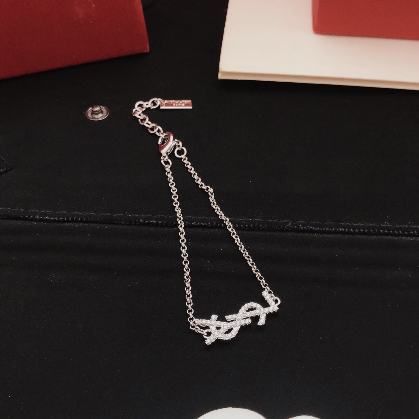 Saint Laurent YSL Monogram Crystal Charm Bracelet bracelet silver-toned metal with clear crystal accents 18cm with 3cm extender