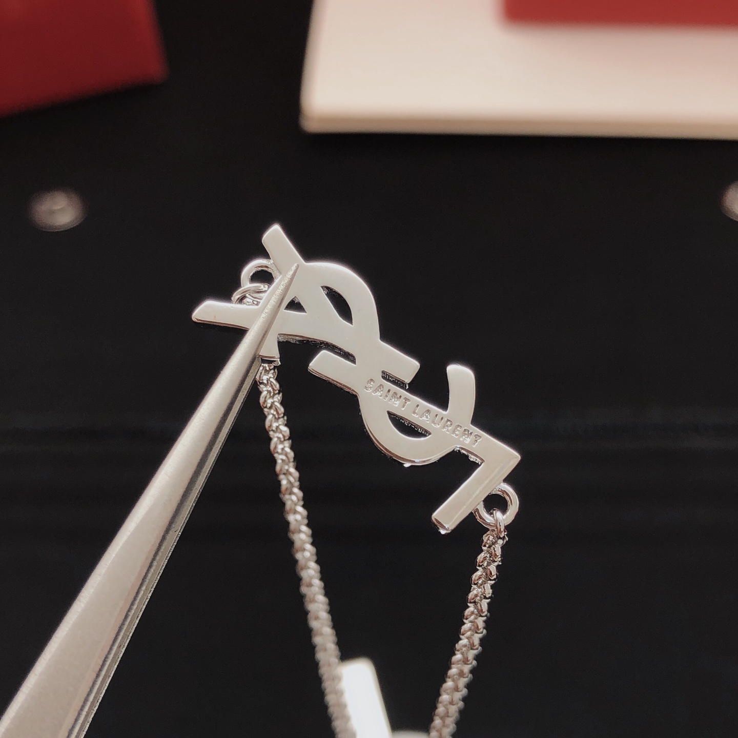 Saint Laurent YSL Monogram Crystal Charm Bracelet bracelet silver-toned metal with clear crystal accents 18cm with 3cm extender