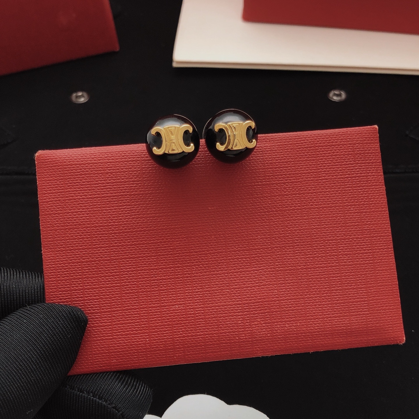 Celine Triomphe earrings gold-tone metal with black resin beads 10mm bead diameter