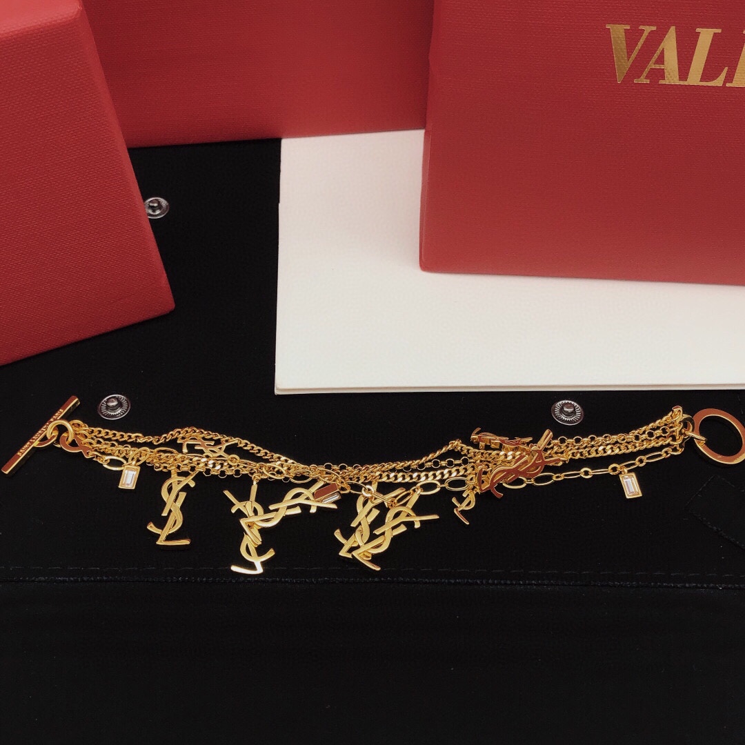 Saint Laurent Cassandre Multi-Charm Toggle Bracelet bracelet gold-tone metal with clear baguette-cut crystal accents 19cm