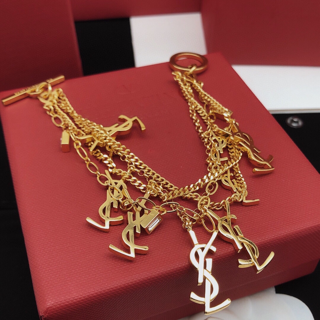 Saint Laurent Cassandre Multi-Charm Toggle Bracelet bracelet gold-tone metal with clear baguette-cut crystal accents 19cm