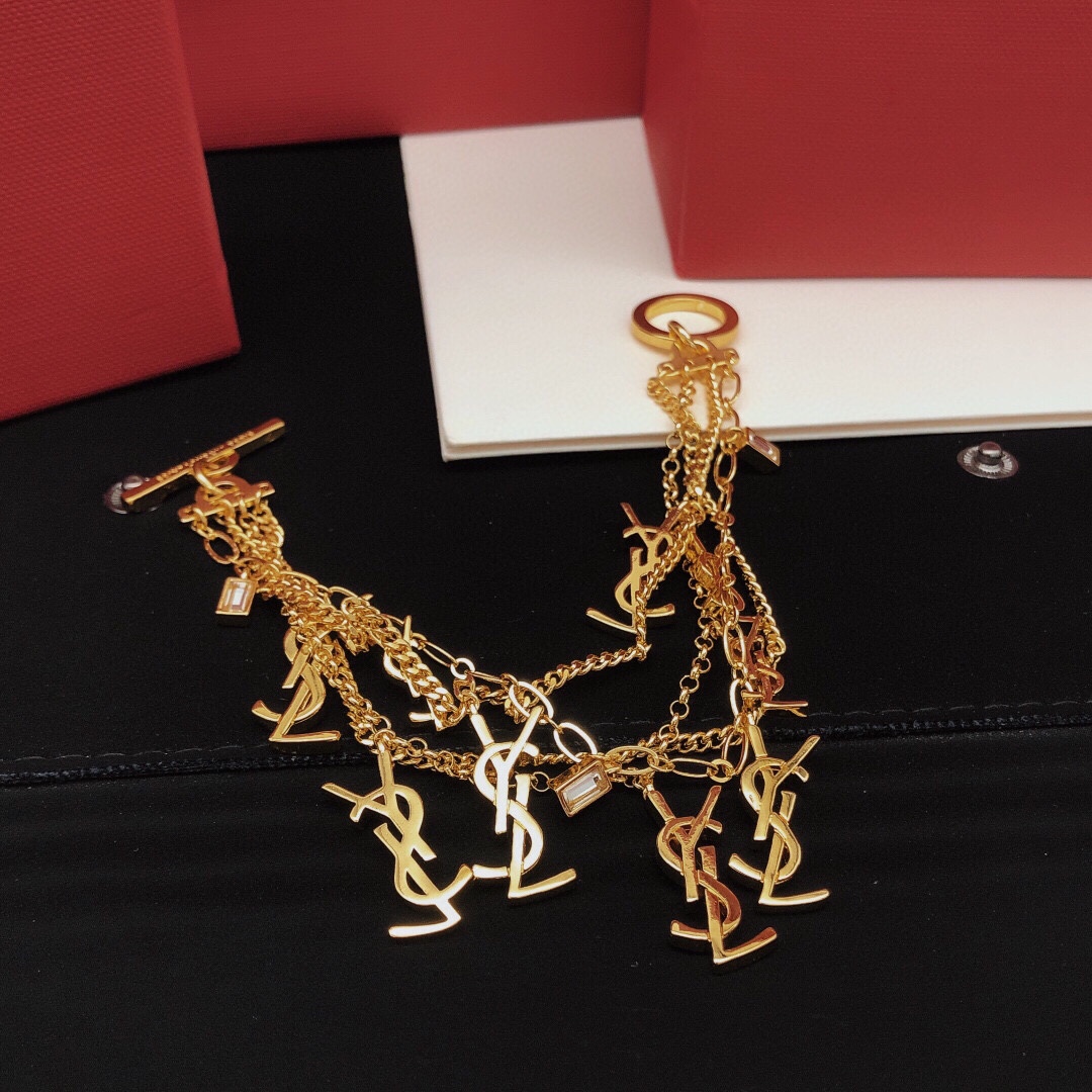 Saint Laurent Cassandre Multi-Charm Toggle Bracelet bracelet gold-tone metal with clear baguette-cut crystal accents 19cm