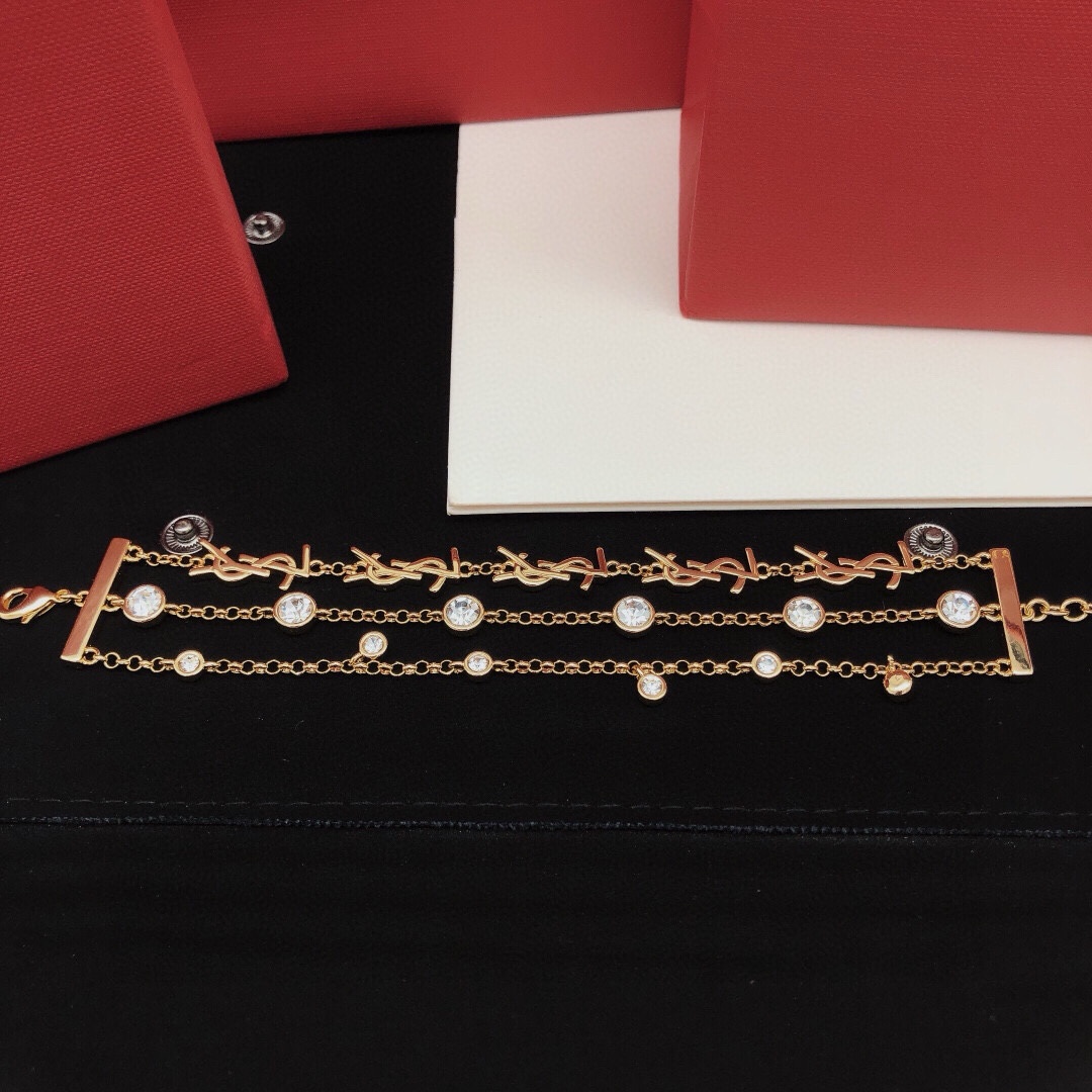 Saint Laurent YSL Monogram Multi-Strand Crystal Bracelet bracelet gold-tone metal with clear faceted crystals 19cm with 3cm extension chain