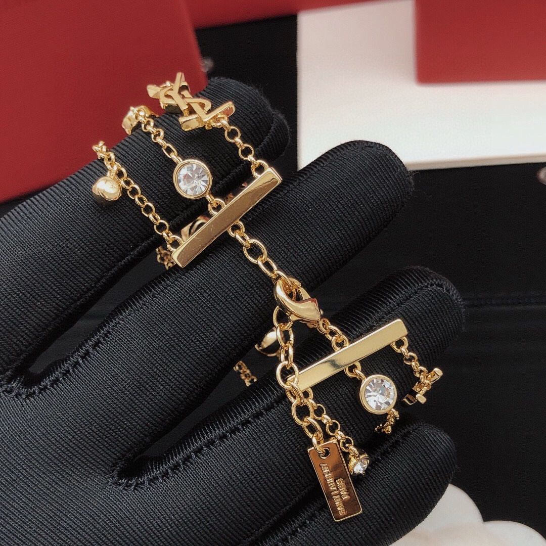 Saint Laurent YSL Monogram Multi-Strand Crystal Bracelet bracelet gold-tone metal with clear faceted crystals 19cm with 3cm extension chain