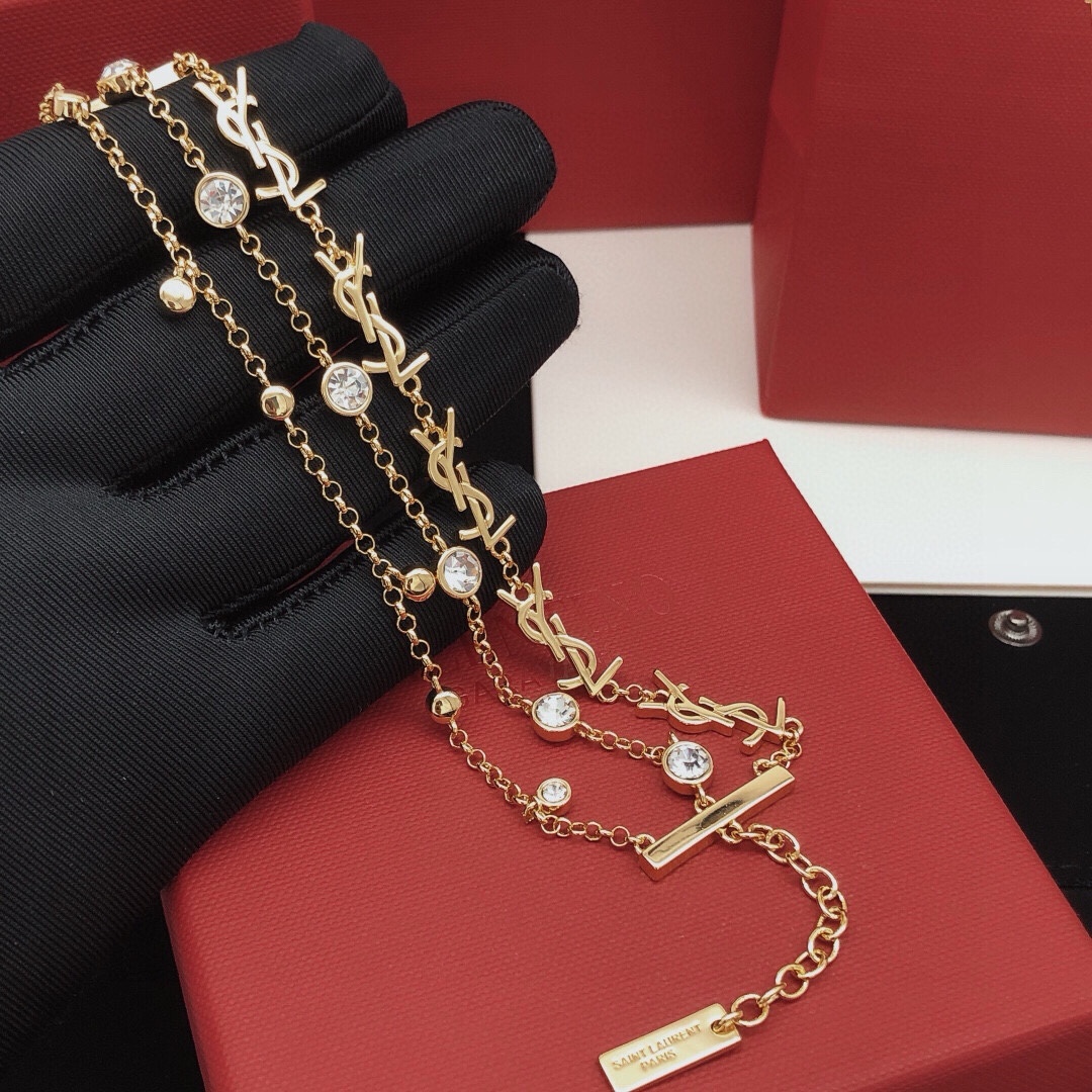 Saint Laurent YSL Monogram Multi-Strand Crystal Bracelet bracelet gold-tone metal with clear faceted crystals 19cm with 3cm extension chain
