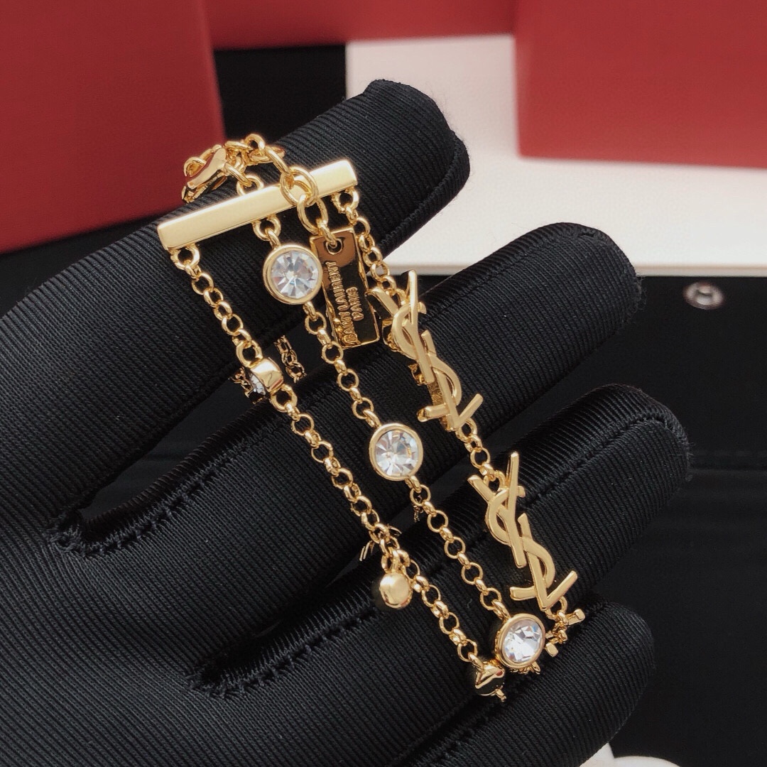 Saint Laurent YSL Monogram Multi-Strand Crystal Bracelet bracelet gold-tone metal with clear faceted crystals 19cm with 3cm extension chain