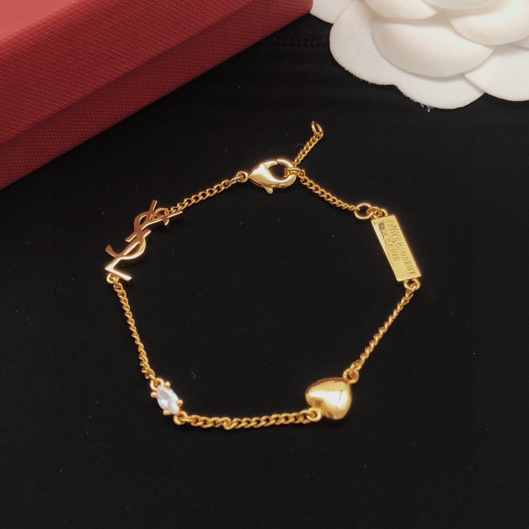 Saint Laurent Cassandre Heart Crystal Charm Bracelet bracelet gold-tone metal with clear faceted crystal 18cm with 2cm extender