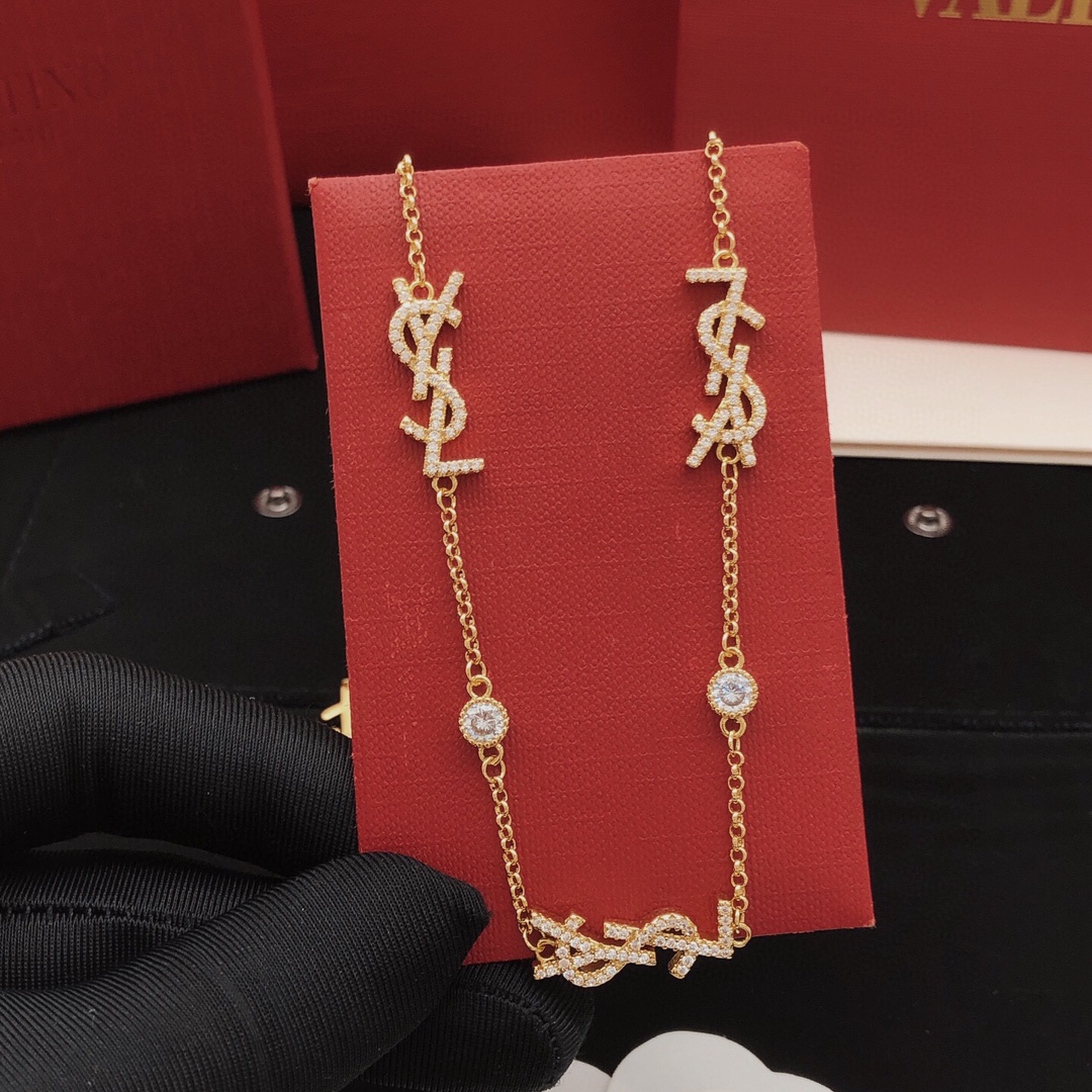 Saint Laurent YSL Monogram Multi-Logo Crystal Station Necklace necklace gold-tone metal with clear crystal accents 42cm with 5cm extender