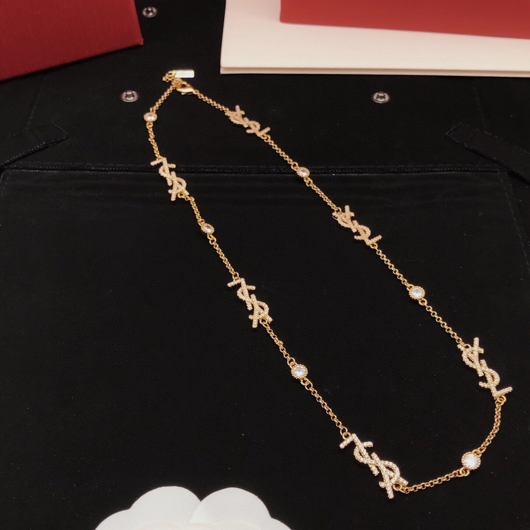 Saint Laurent YSL Monogram Multi-Logo Crystal Station Necklace necklace gold-tone metal with clear crystal accents 42cm with 5cm extender
