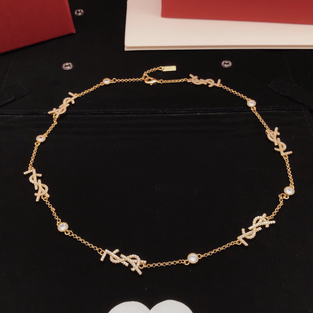 Saint Laurent YSL Monogram Multi-Logo Crystal Station Necklace necklace gold-tone metal with clear crystal accents 42cm with 5cm extender