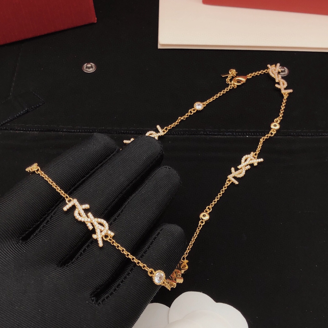 Saint Laurent YSL Monogram Multi-Logo Crystal Station Necklace necklace gold-tone metal with clear crystal accents 42cm with 5cm extender