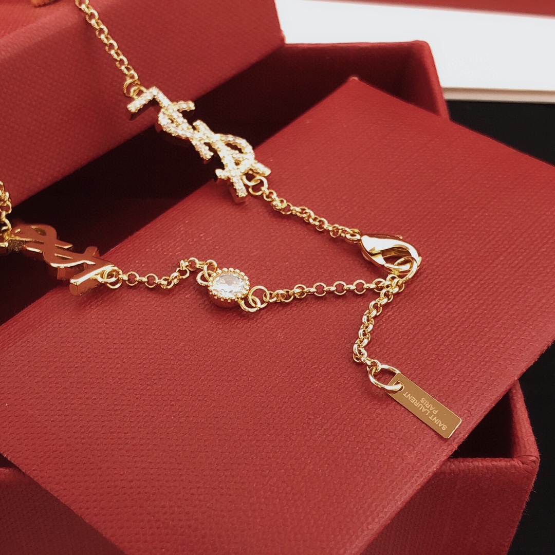 Saint Laurent YSL Monogram Multi-Logo Crystal Station Necklace necklace gold-tone metal with clear crystal accents 42cm with 5cm extender