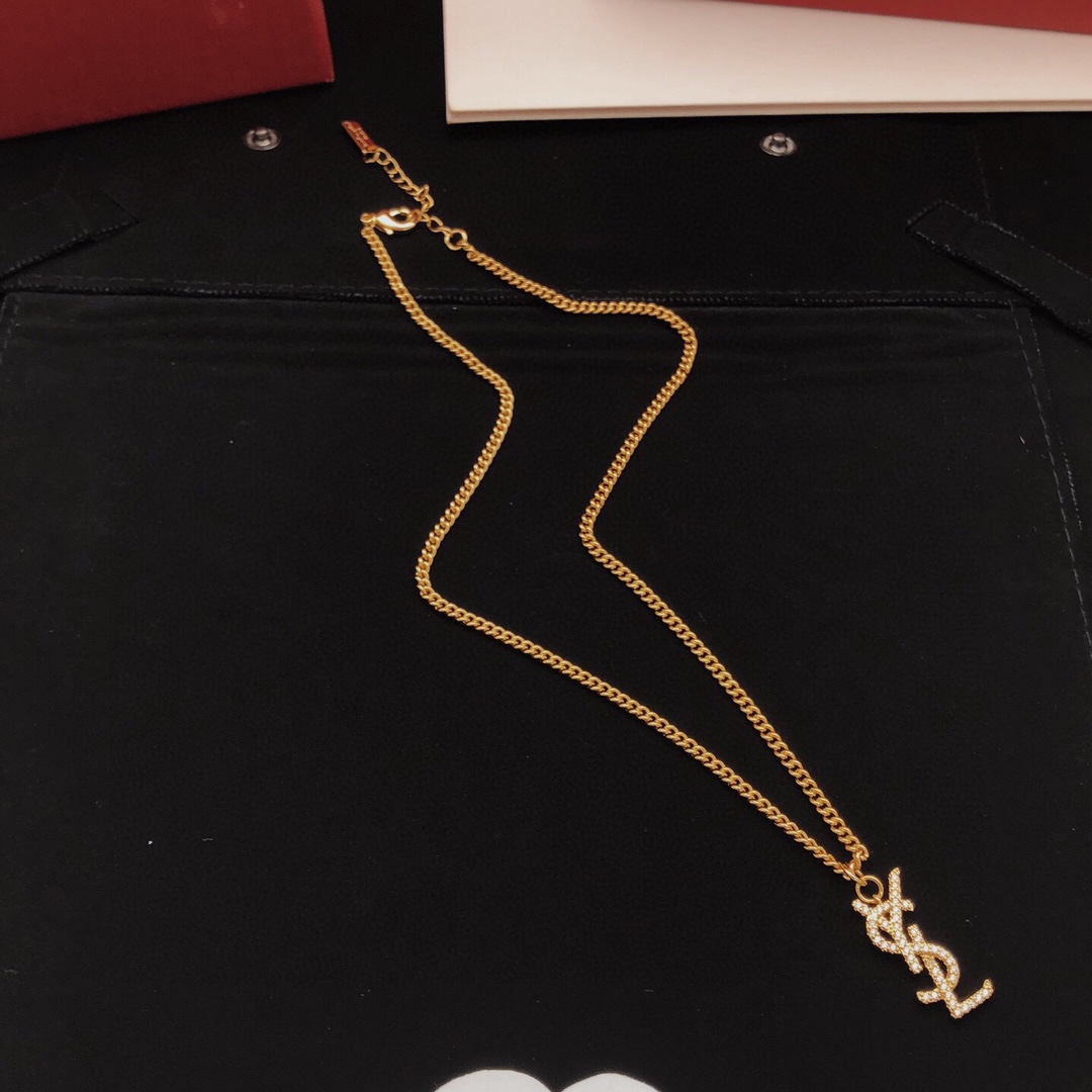 Saint Laurent YSL Monogram Crystal Pendant Necklace necklace gold-tone metal with clear crystal pave 45cm with 5cm extender