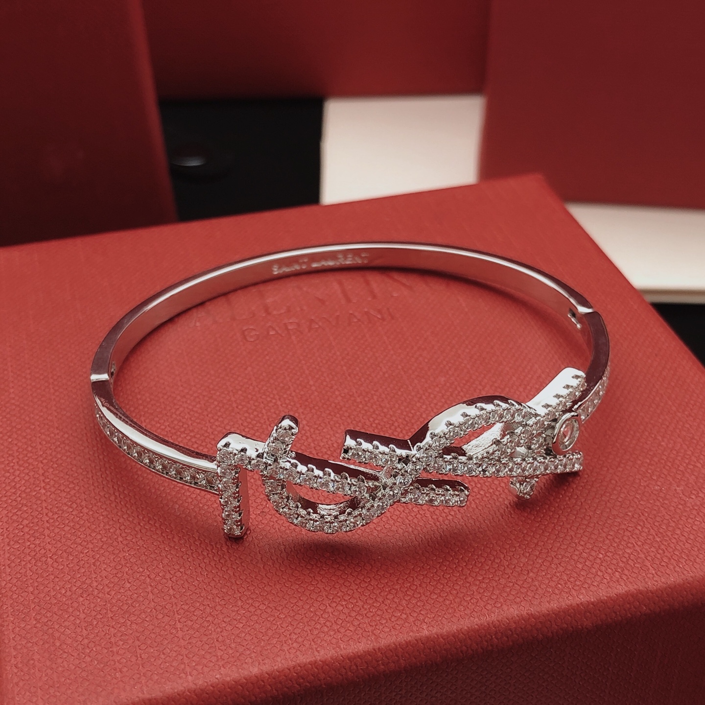 Saint Laurent Cassandre Monogram Pave Bangle bracelet silver-toned metal with clear pave crystals 17cm inner circumference