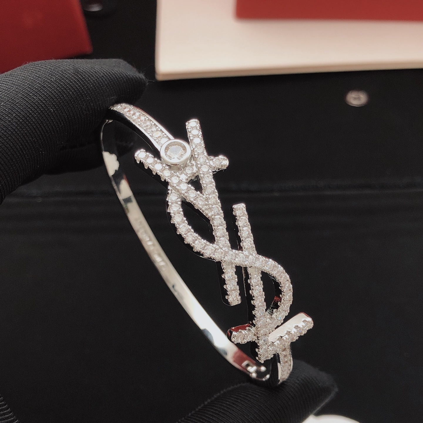 Saint Laurent Cassandre Monogram Pave Bangle bracelet silver-toned metal with clear pave crystals 17cm inner circumference