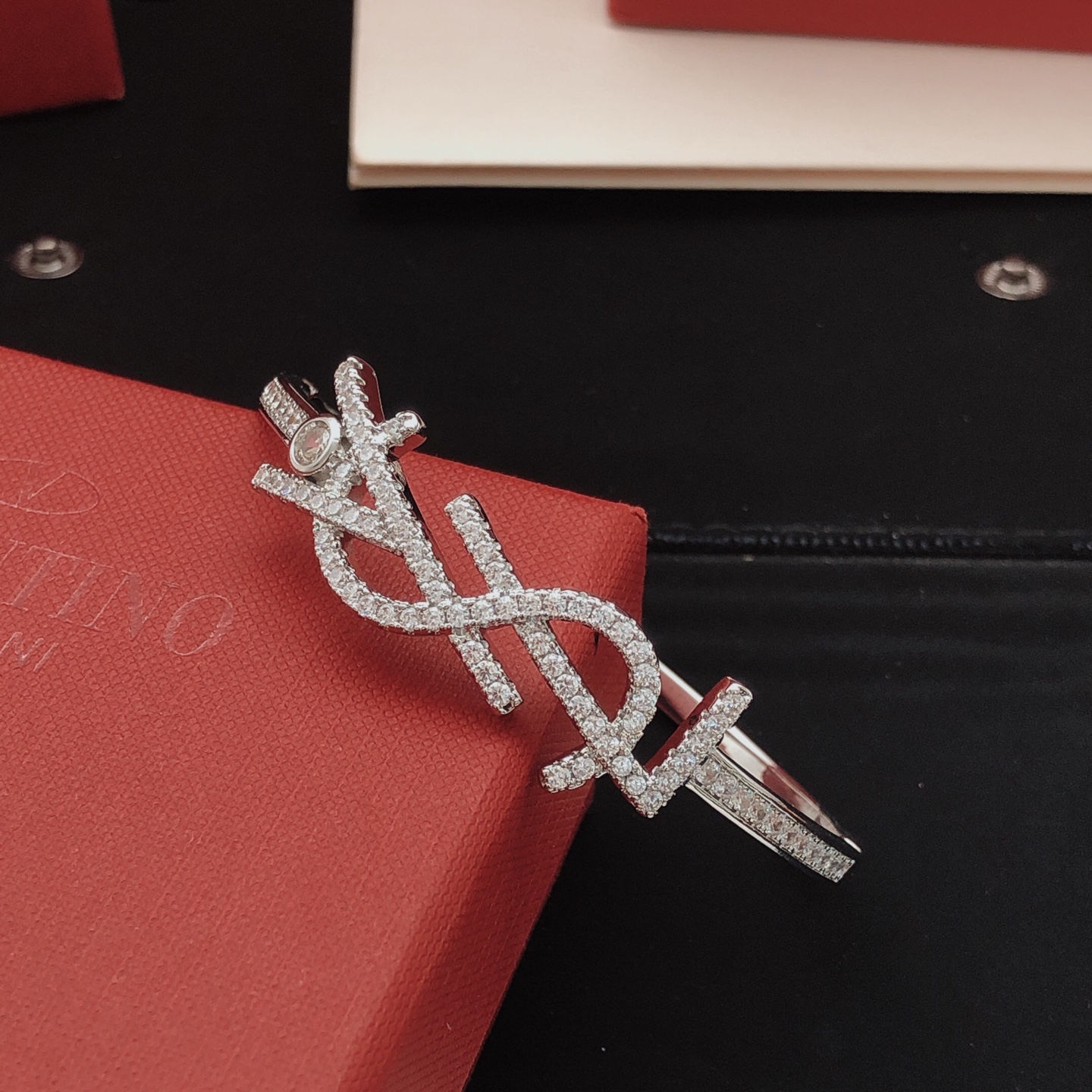 Saint Laurent Cassandre Monogram Pave Bangle bracelet silver-toned metal with clear pave crystals 17cm inner circumference