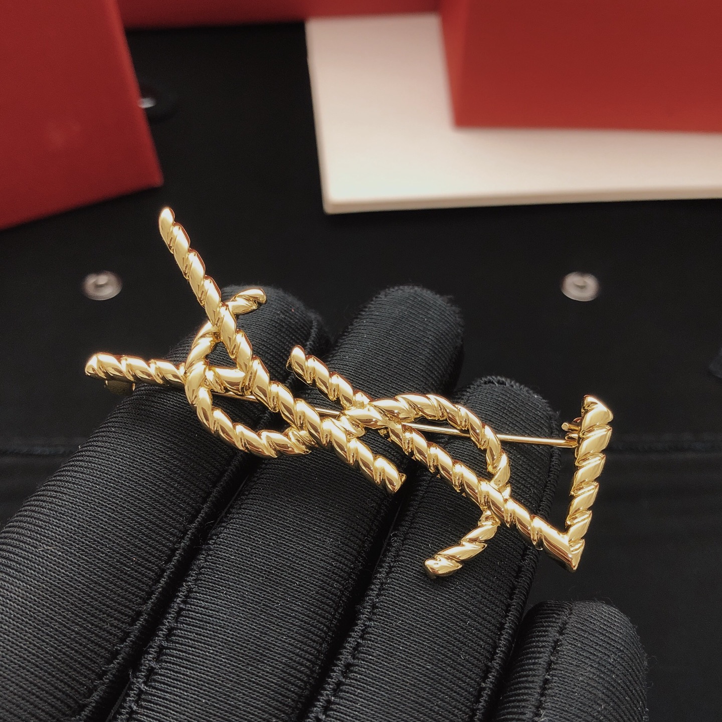 Saint Laurent Cassandre Twisted Monogram Brooch brooch gold-tone metal no gemstones 4 5cm height