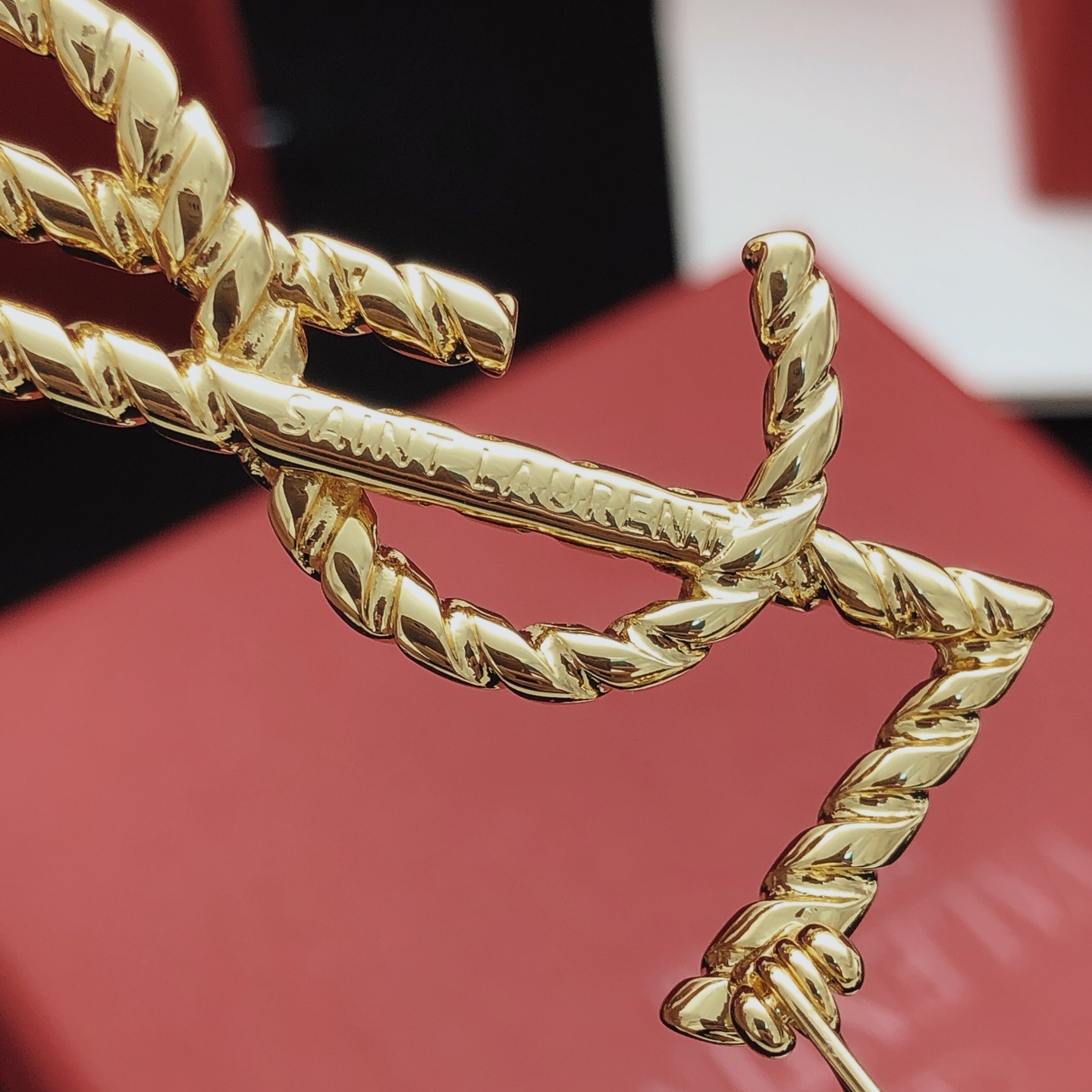 Saint Laurent Cassandre Twisted Monogram Brooch brooch gold-tone metal no gemstones 4 5cm height