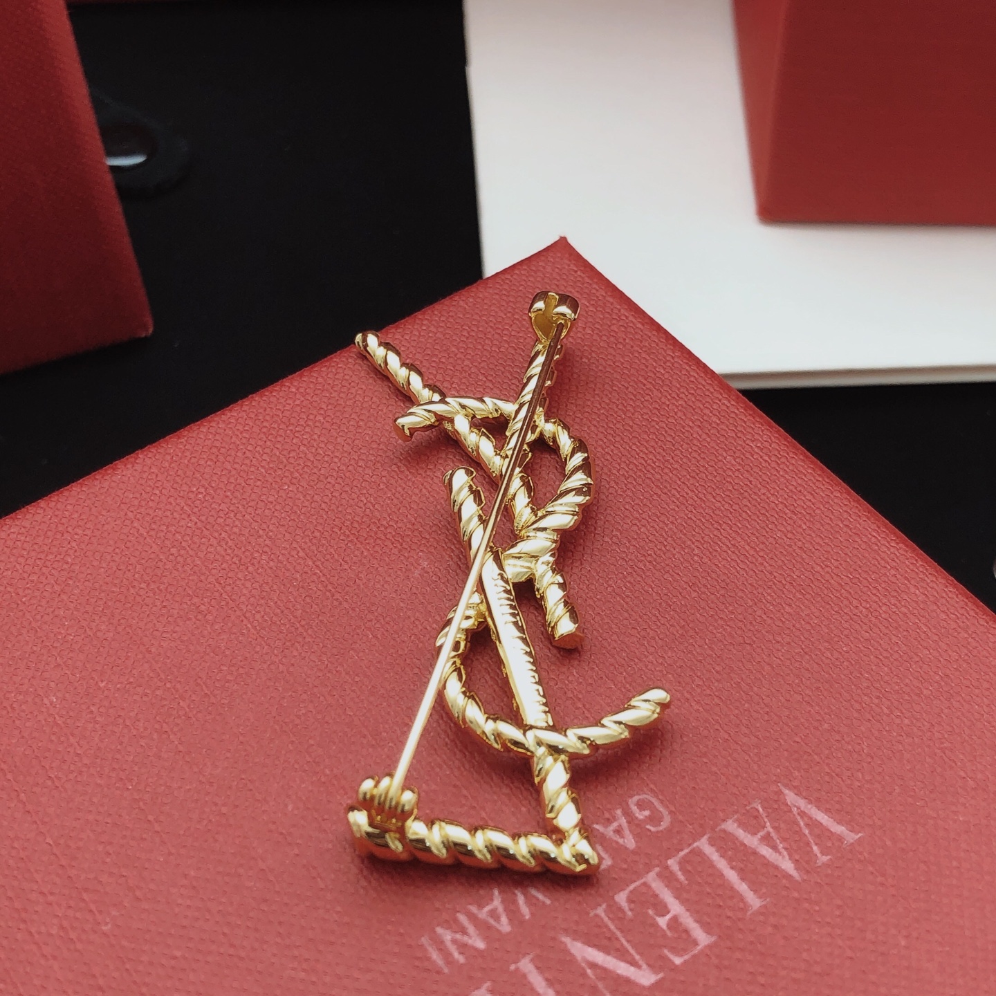 Saint Laurent Cassandre Twisted Monogram Brooch brooch gold-tone metal no gemstones 4 5cm height