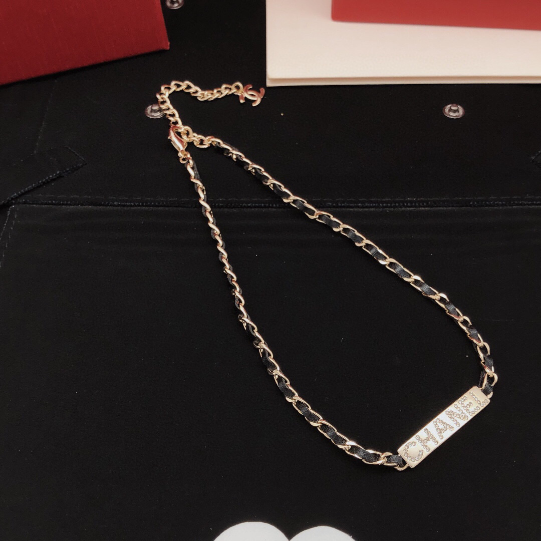 Chanel Leather Woven Chain Crystal Logo Plate Choker necklace Gold-tone metal black leather clear crystal 40cm with 5cm extender