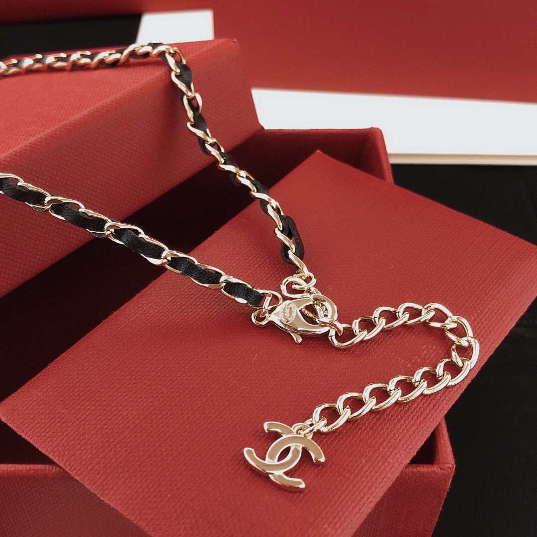 Chanel Leather Woven Chain Crystal Logo Plate Choker necklace Gold-tone metal black leather clear crystal 40cm with 5cm extender
