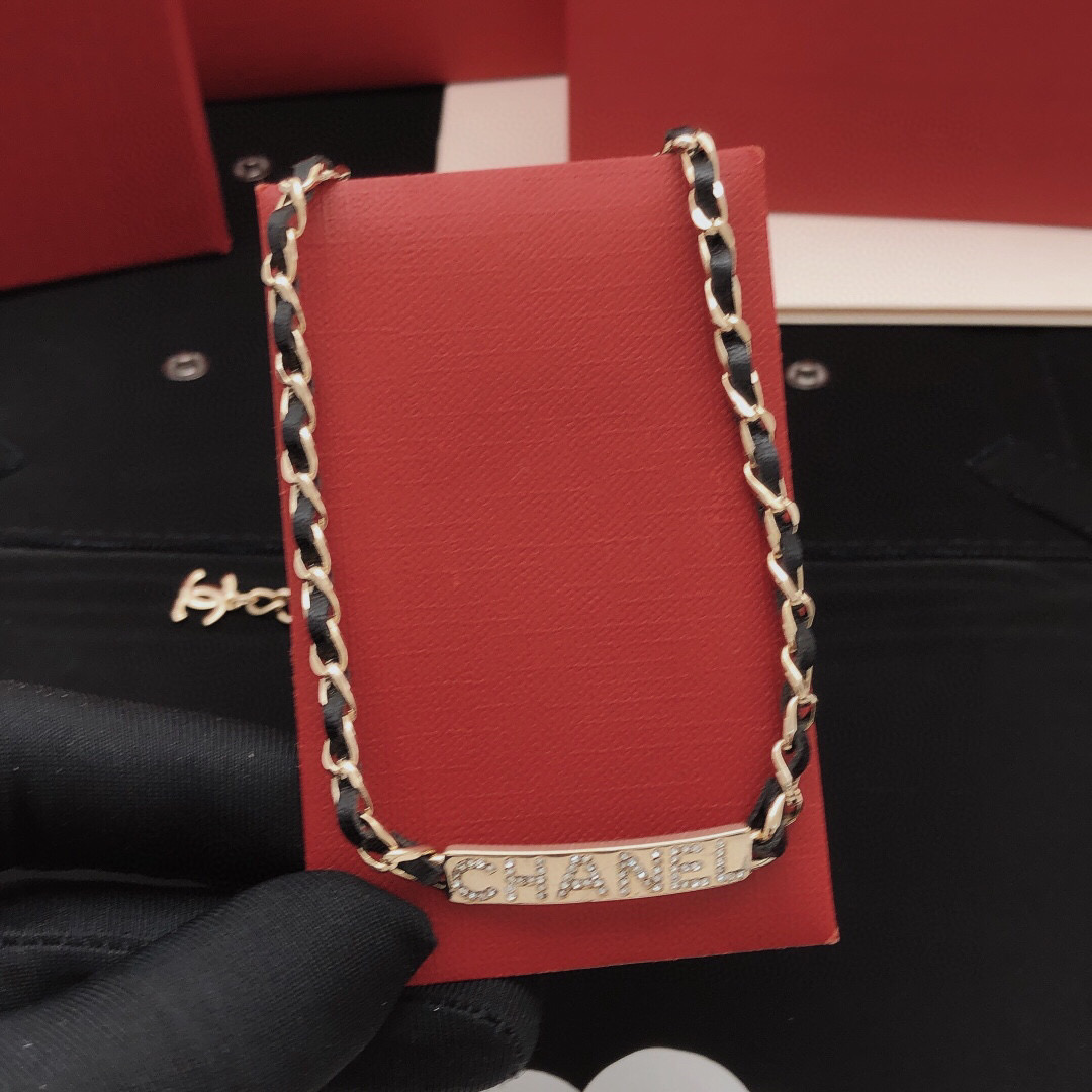 Chanel Leather Woven Chain Crystal Logo Plate Choker necklace Gold-tone metal black leather clear crystal 40cm with 5cm extender