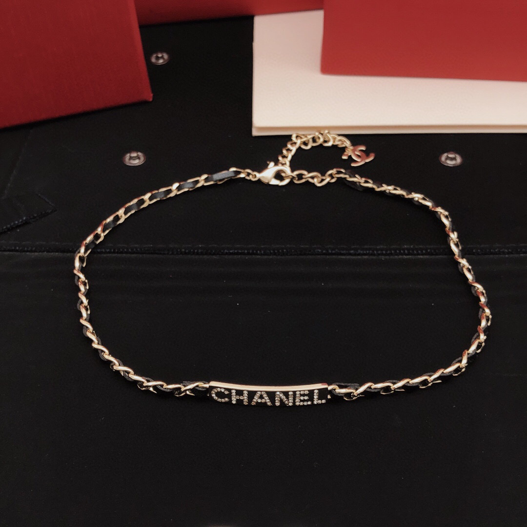 Chanel Leather Woven Chain Crystal Logo Plate Choker necklace Gold-tone metal black leather clear crystal 40cm with 5cm extender
