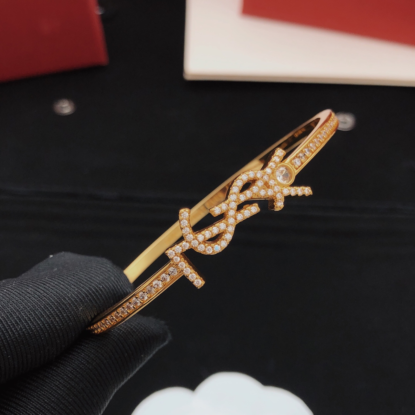 Saint Laurent Cassandre YSL Monogram Crystal Bangle bracelet gold-tone metal with clear crystal accents 17cm inner circumference
