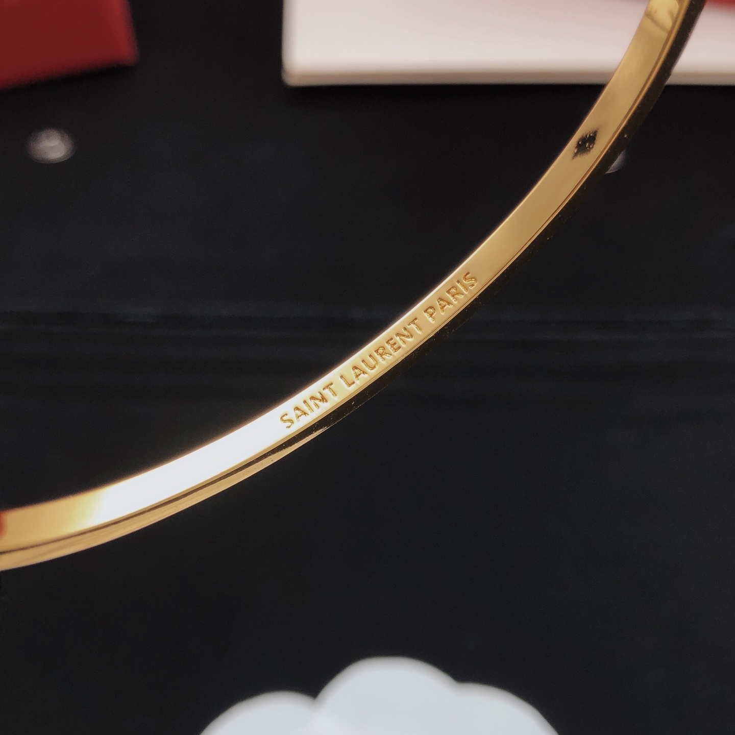 Saint Laurent Cassandre YSL Monogram Crystal Bangle bracelet gold-tone metal with clear crystal accents 17cm inner circumference