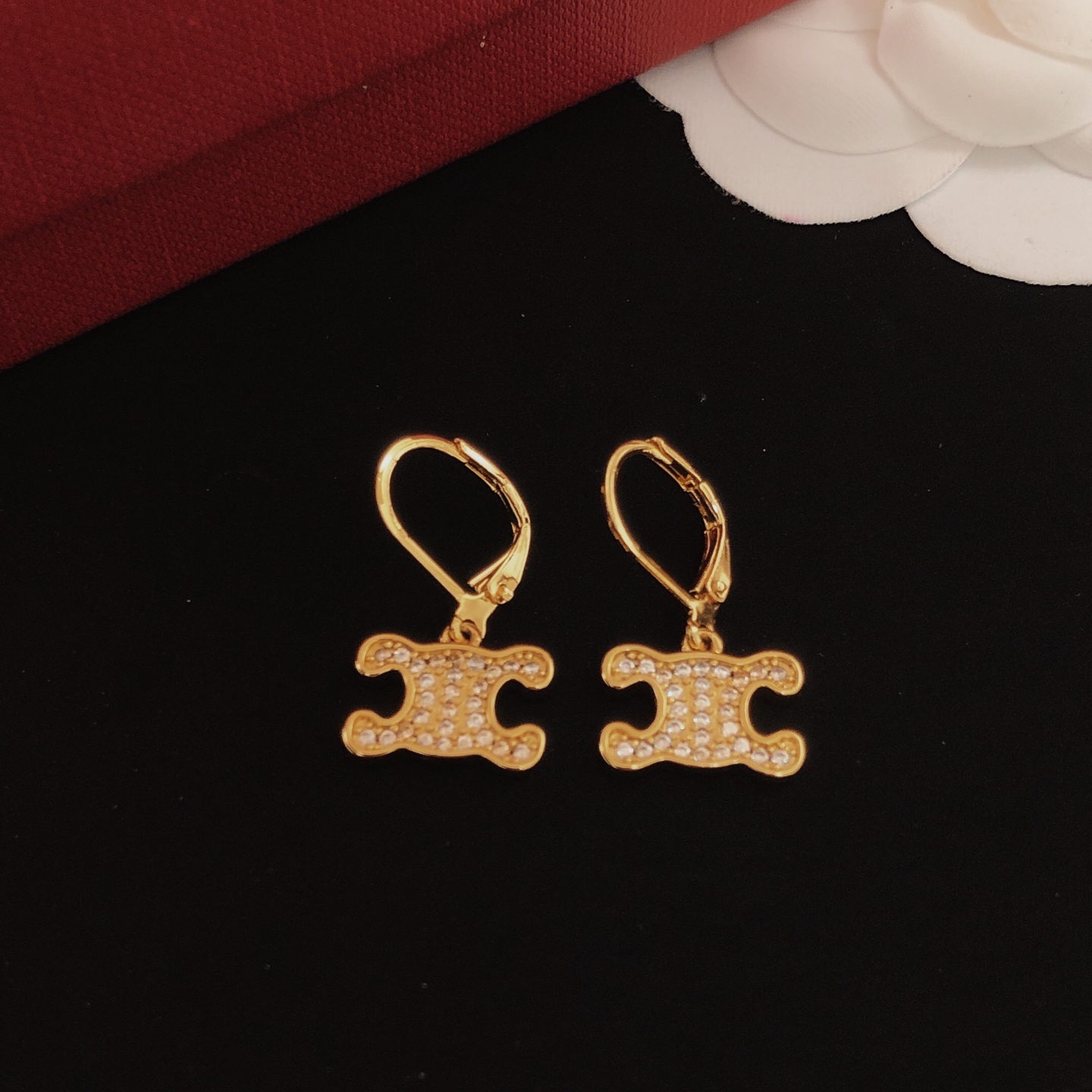 Celine Triomphe earrings gold-tone metal with clear crystal accents 1 5cm drop