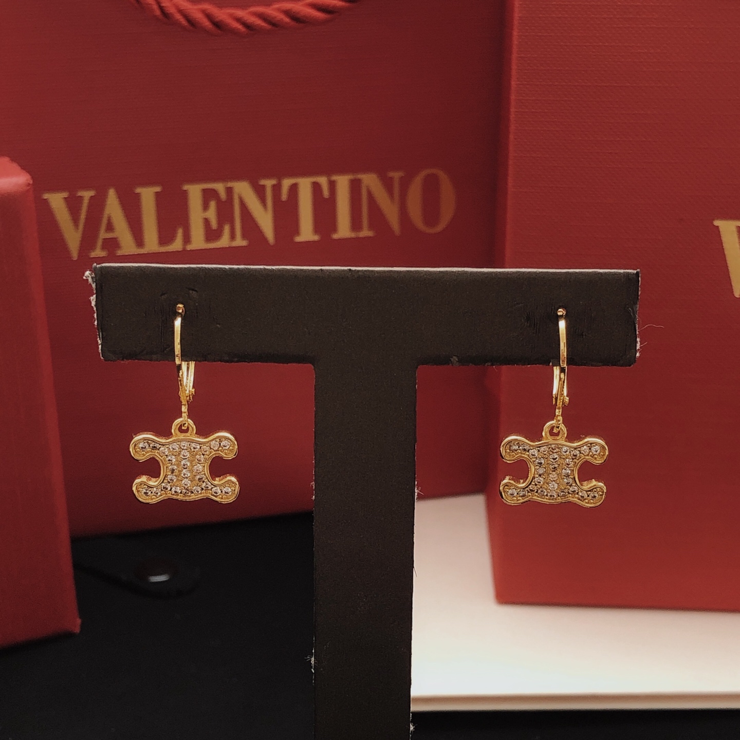 Celine Triomphe earrings gold-tone metal with clear crystal accents 1 5cm drop