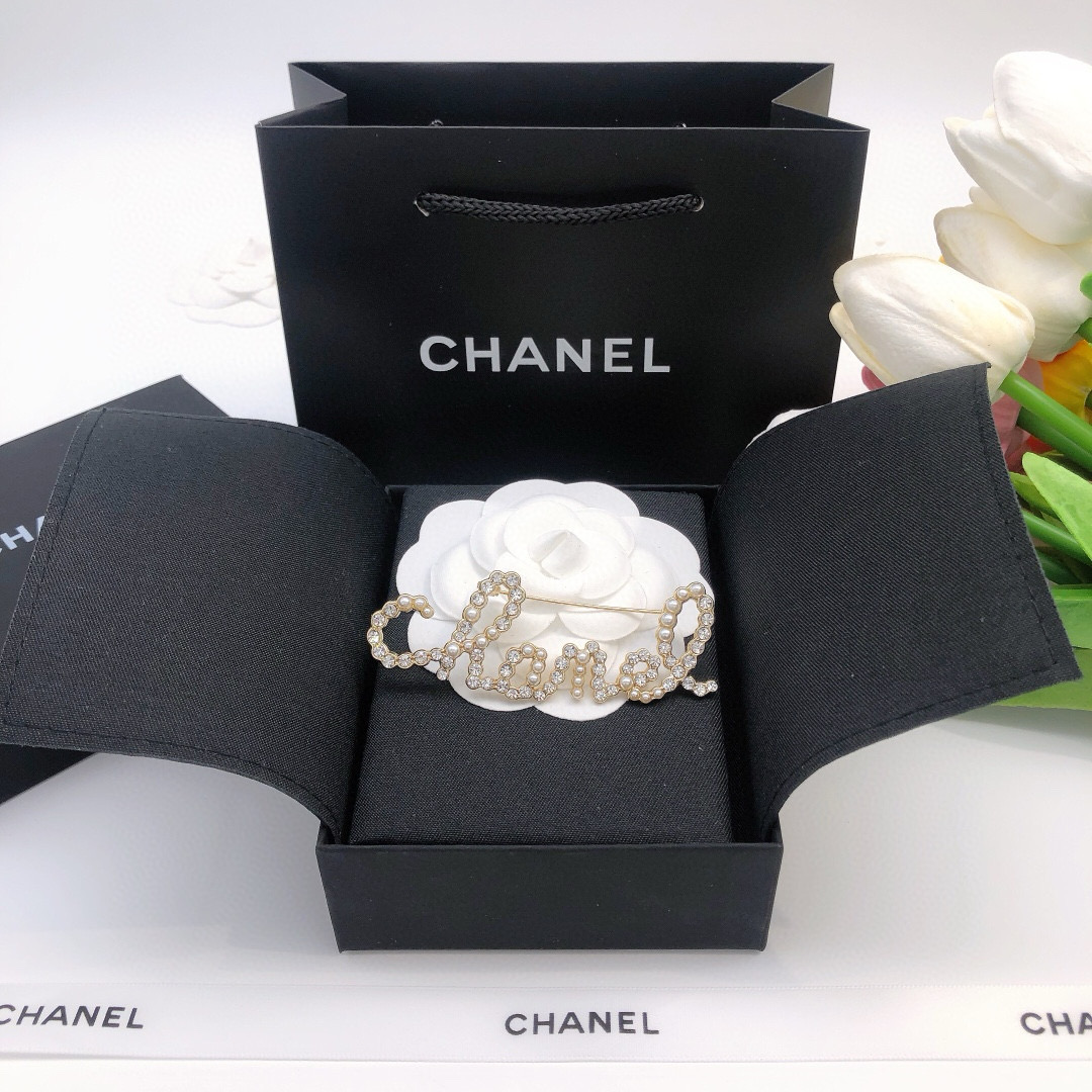 Chanel Cursive Script Logo Brooch brooch gold-tone metal clear crystal white faux pearl 6cm width