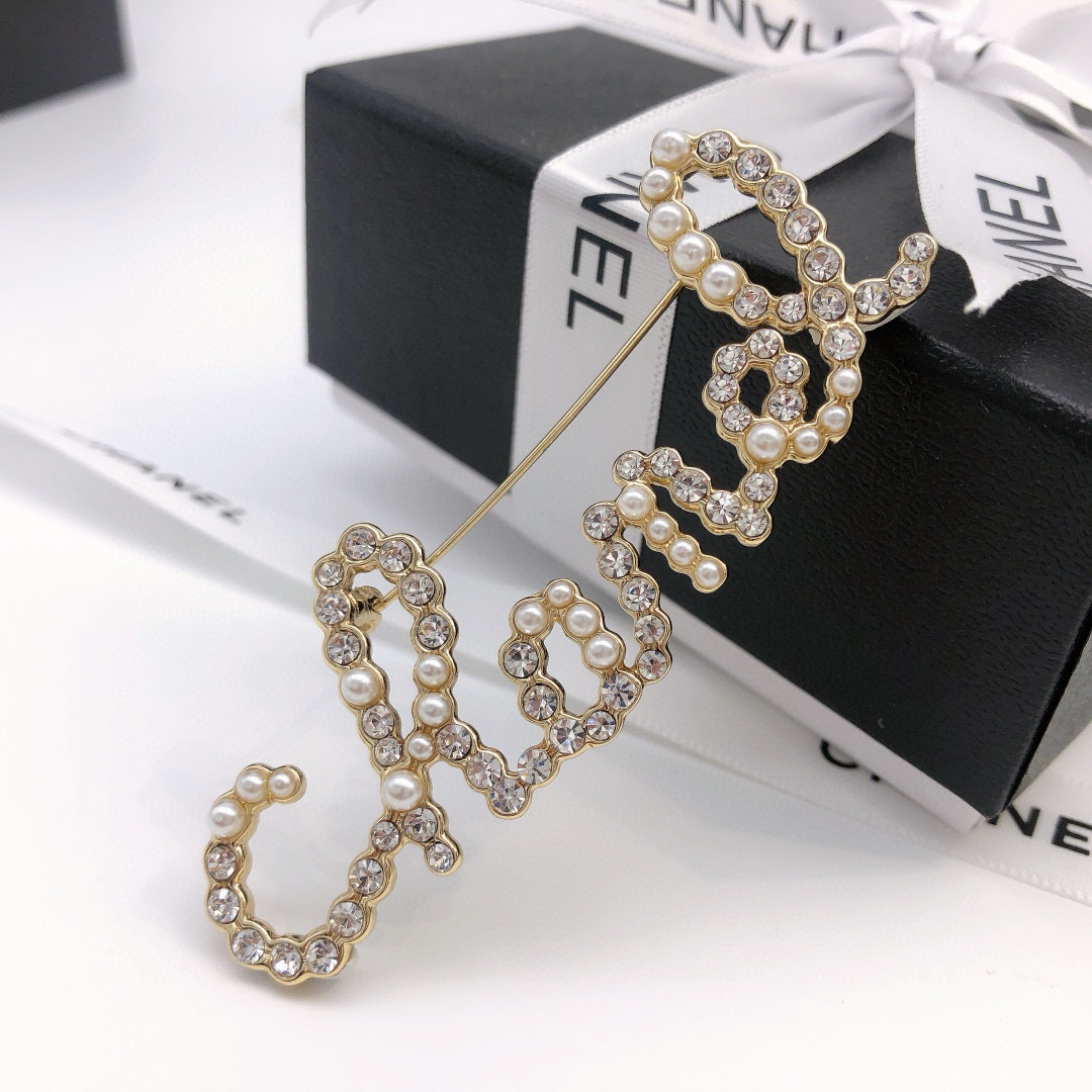 Chanel Cursive Script Logo Brooch brooch gold-tone metal clear crystal white faux pearl 6cm width